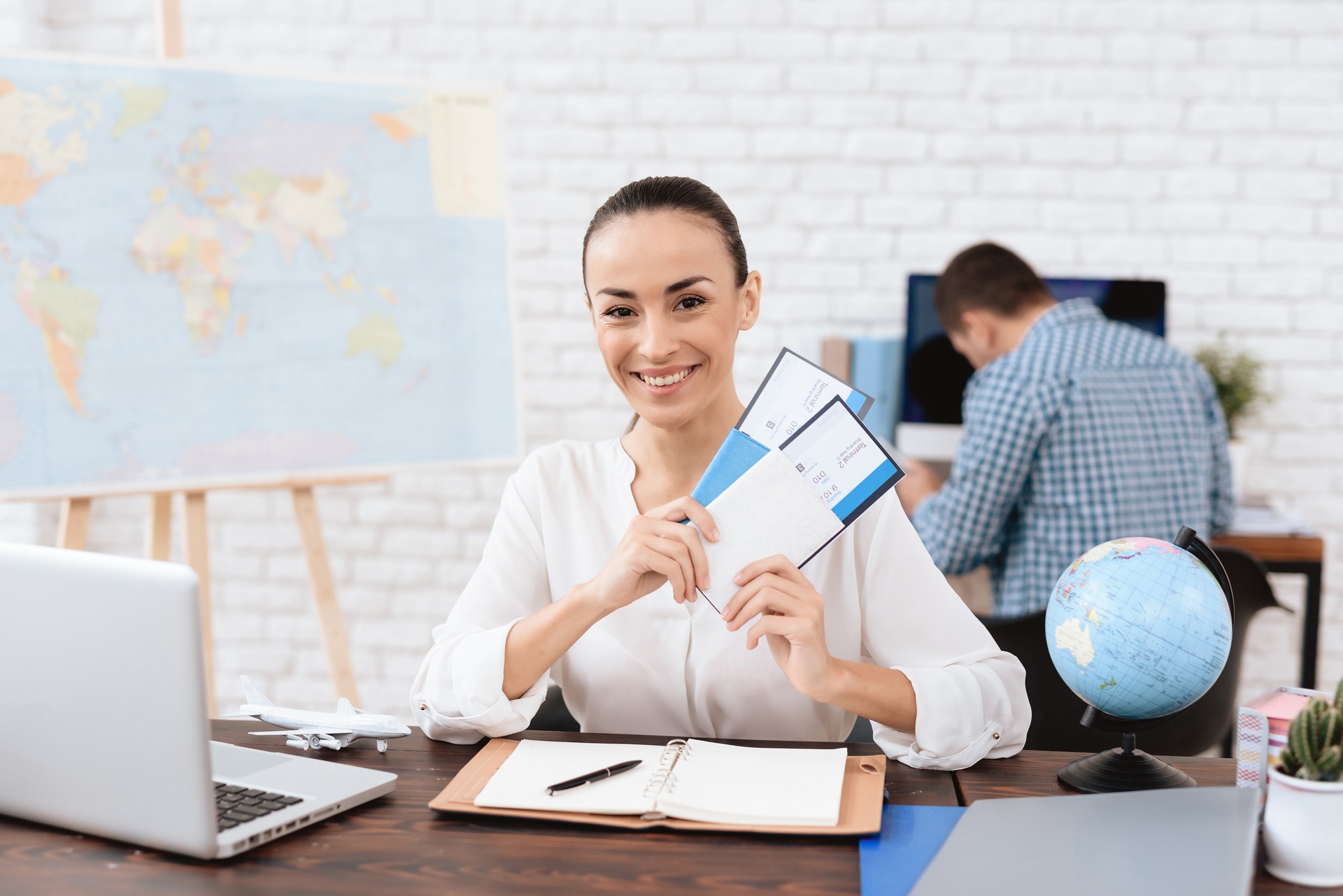 The travel agent keeps tickets for the plane in the travel agency.